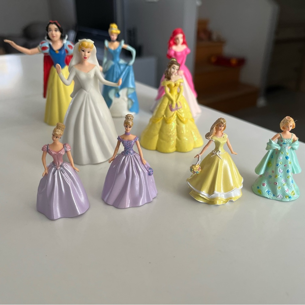 9 Disney princess figurines. They’re sturdy plastic & are so fun to play with!